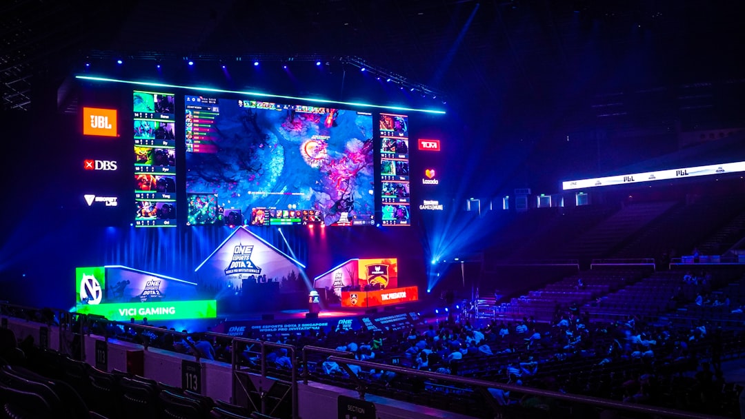 crowd of people watching Mobile Legends game on big screen, Dota 2 tournament in stadium
