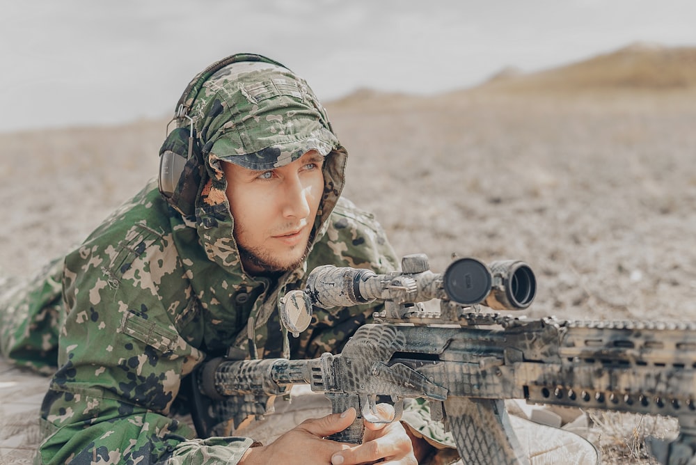 man holding sniper rifle