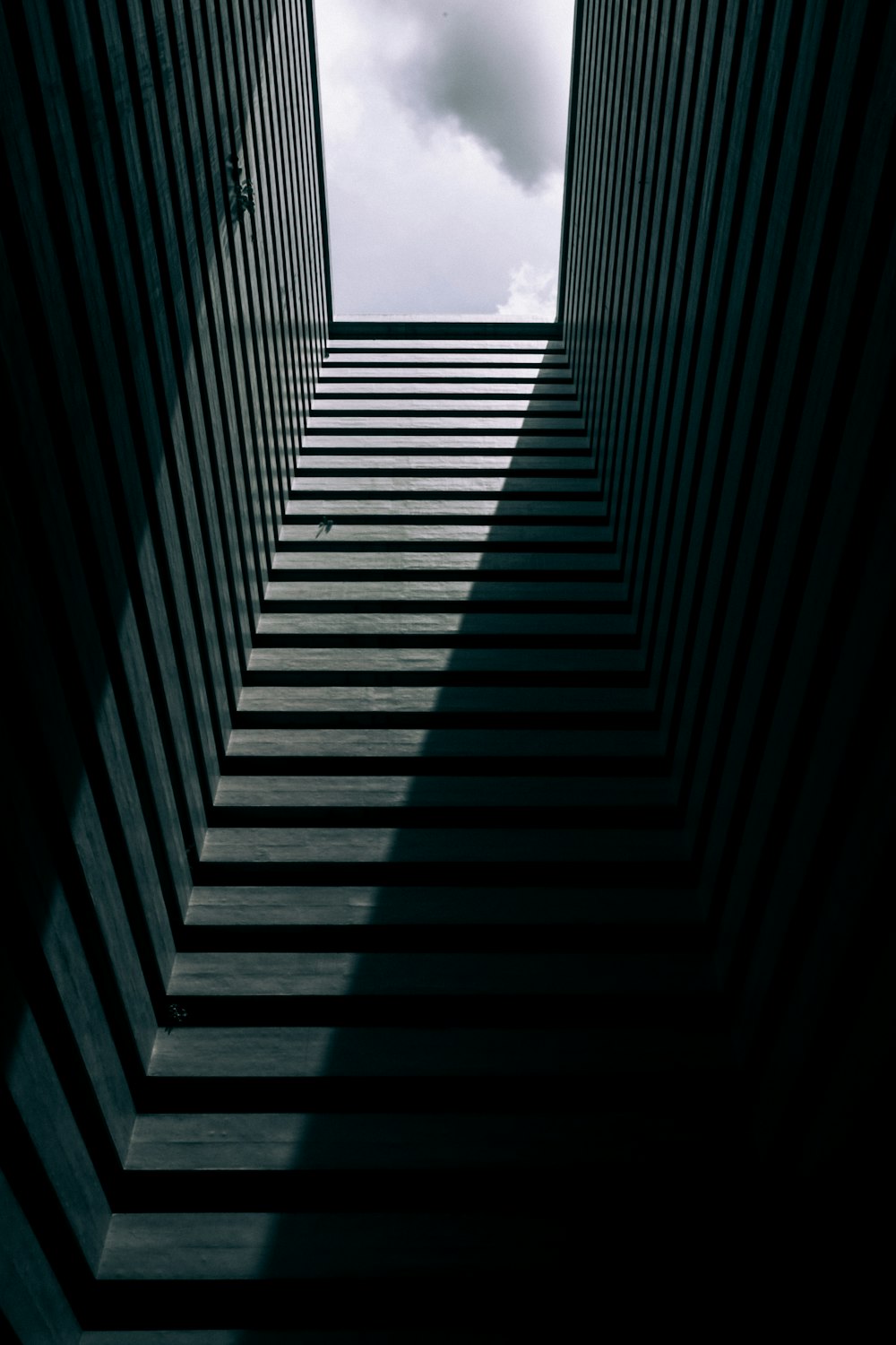 a very tall building with a sky in the background