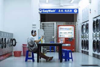 man sitting on chair in front of table