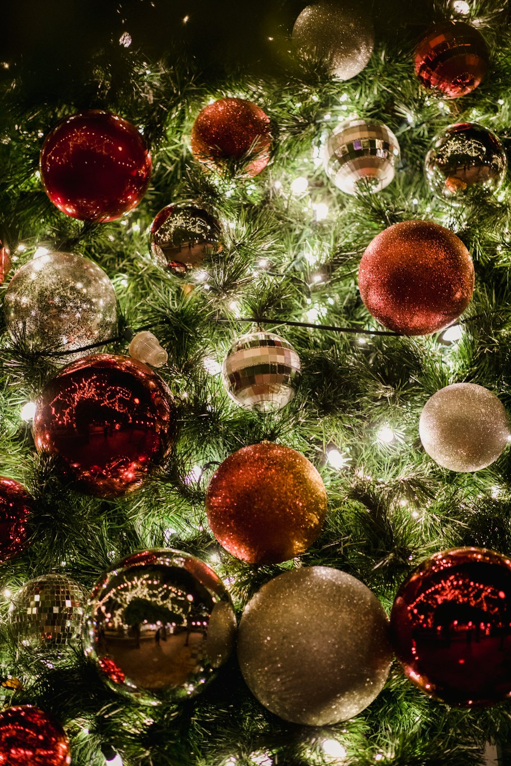 assorted-color christmas baubles in tree