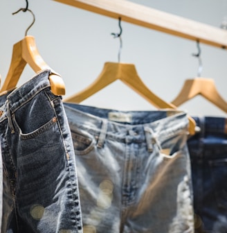 selective focus photography of hanged denim jeans