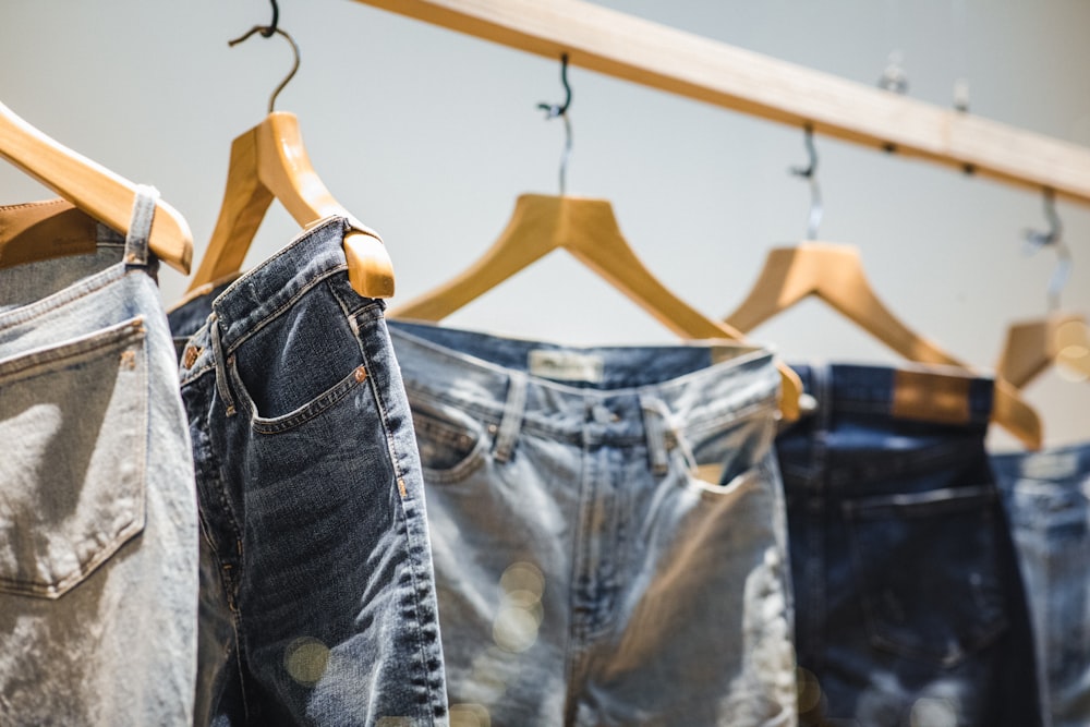 selective focus photography of hanged denim jeans