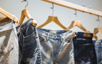 selective focus photography of hanged denim jeans