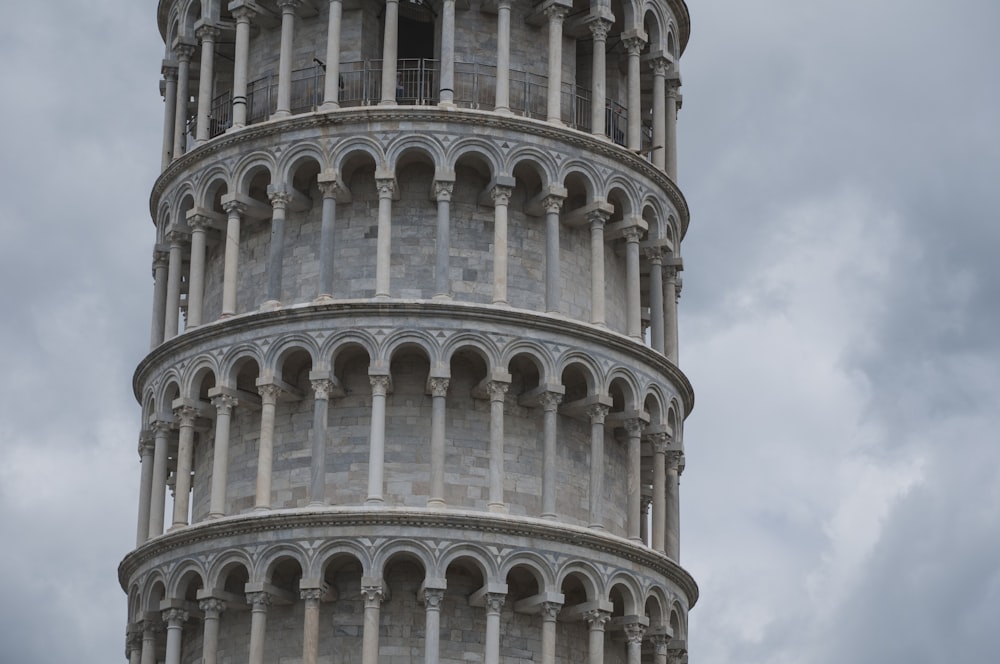 a very tall tower with a clock on it's side