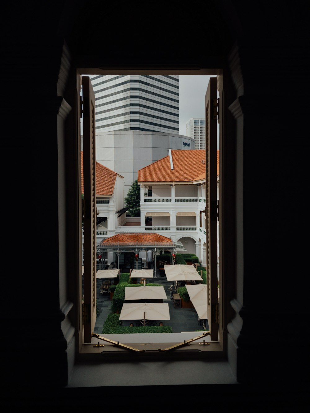 window overlooking sheds during daytime