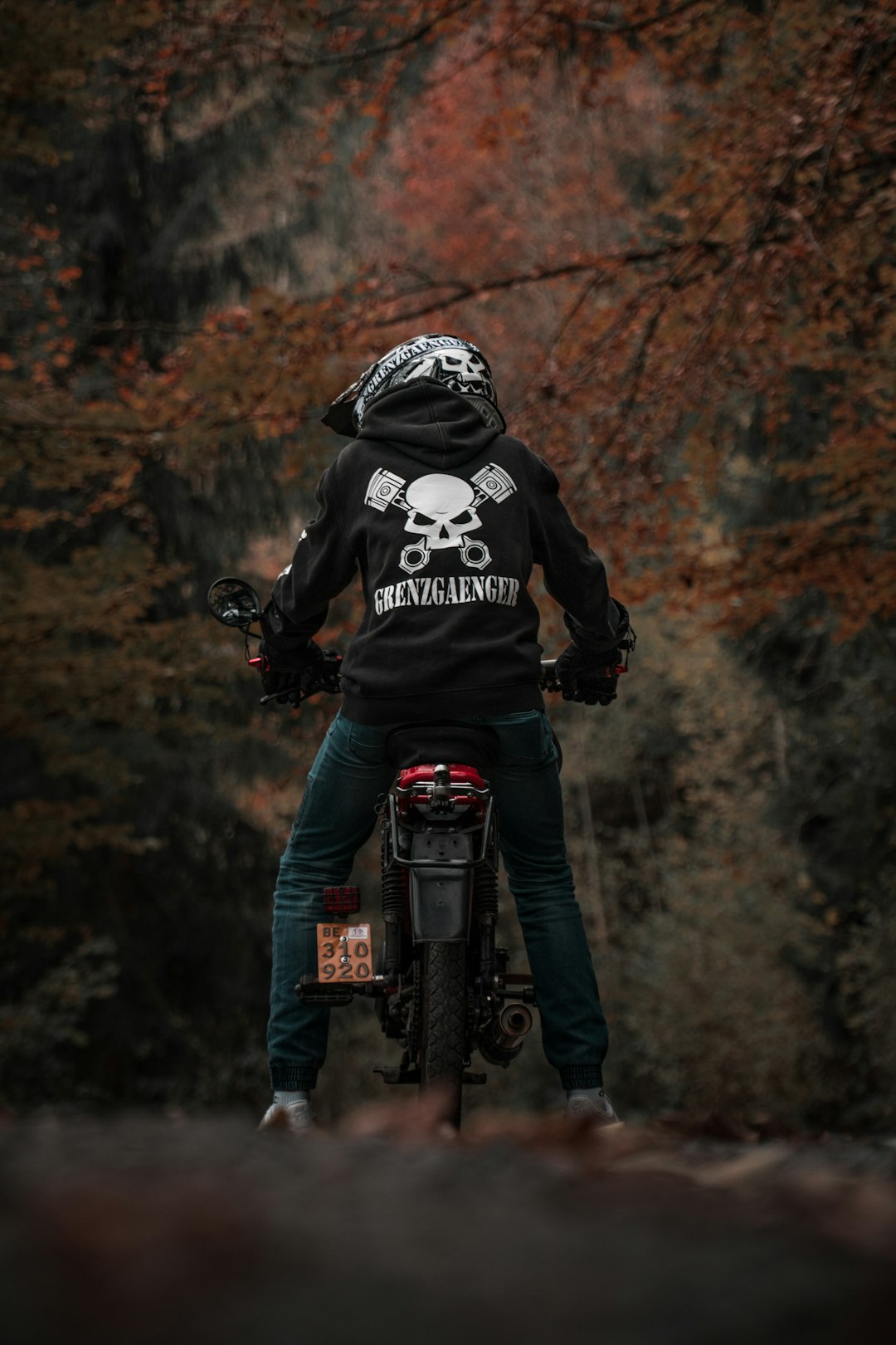 selective focus photography of person riding motorcycle