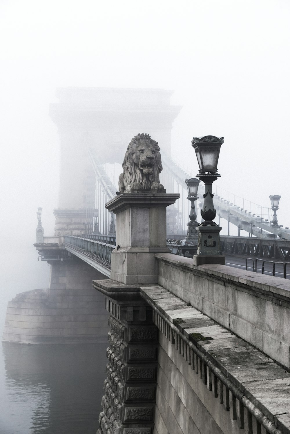 lion statue on the bridge photograph