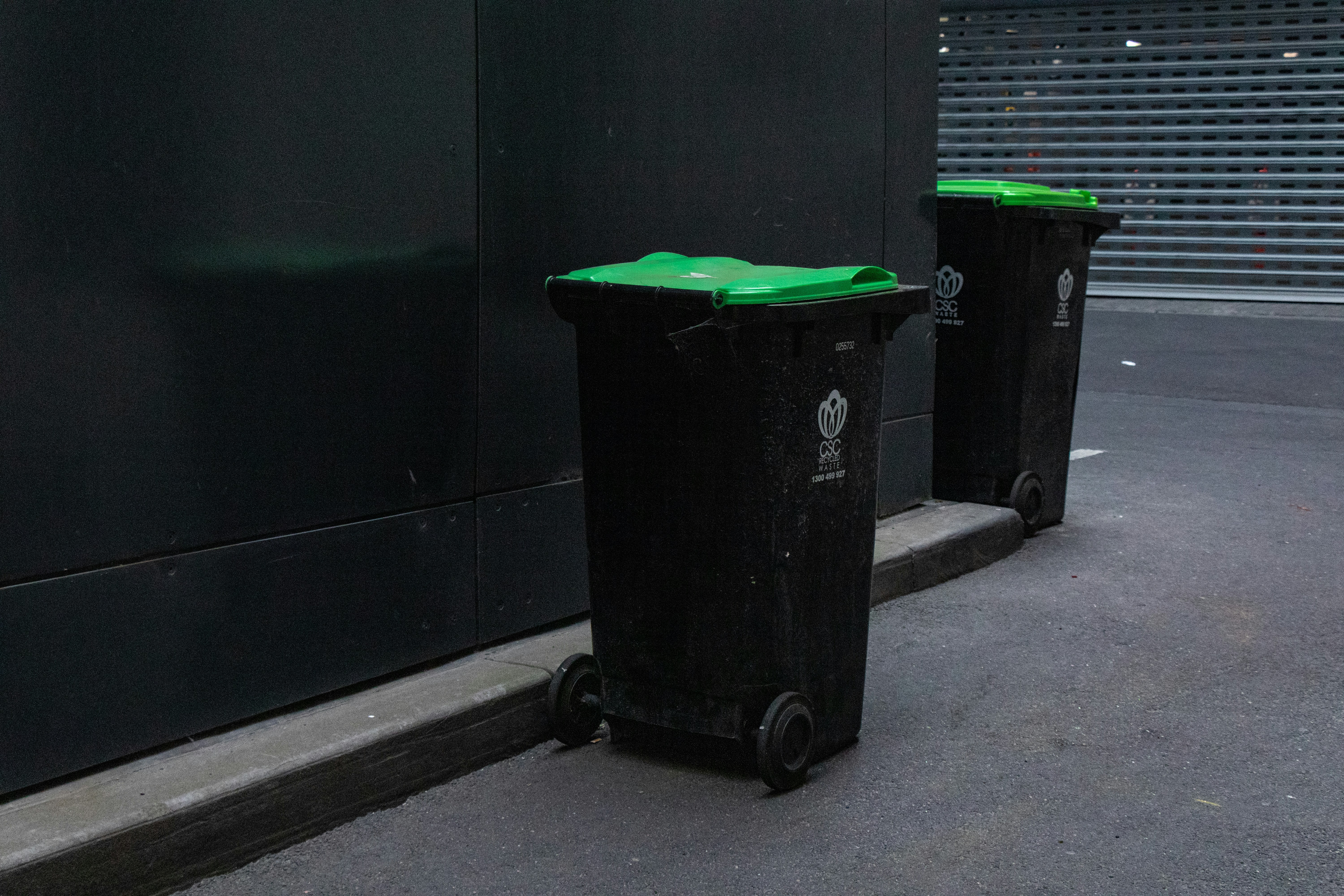 Green bins on the corner