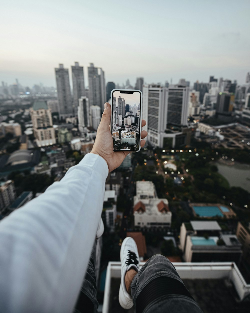 selective focus photography of person talking photo of city buildings