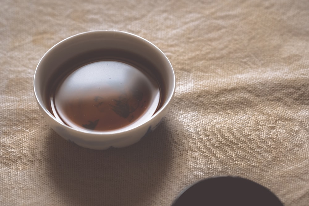 bowl of liquid on white surface