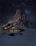 A cozy chalet nestled in fresh snow under a twilight sky in the French Alps.
