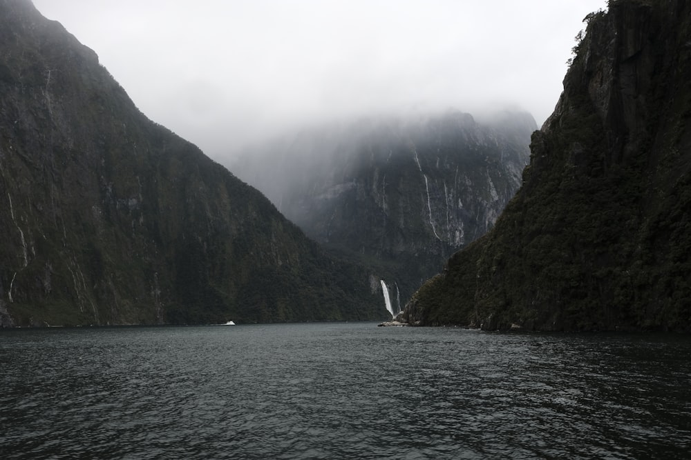 body of water under cloudy sky