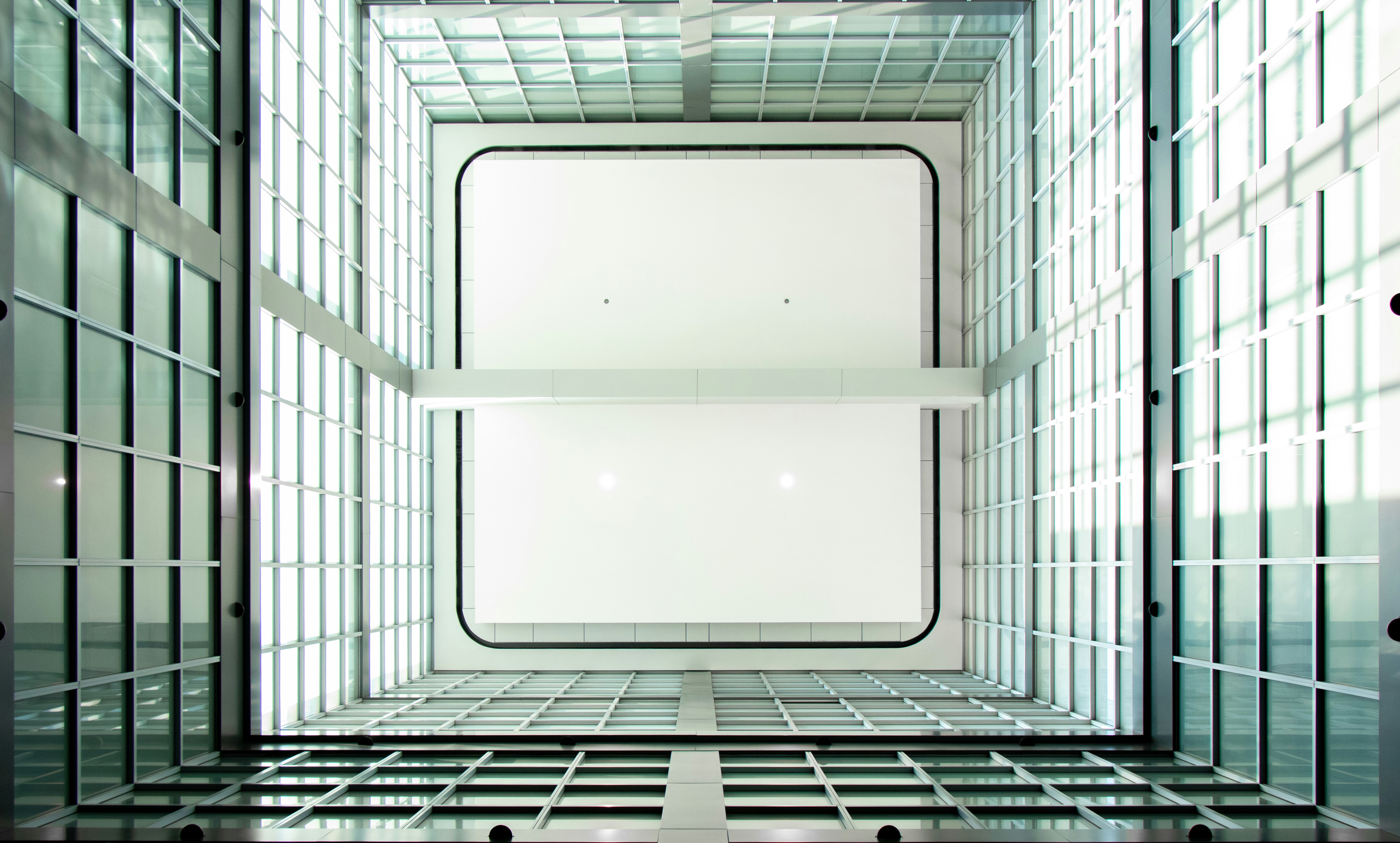 A clean, well-maintained elevator interior with a visible inspection certificate - apartments with elevator access