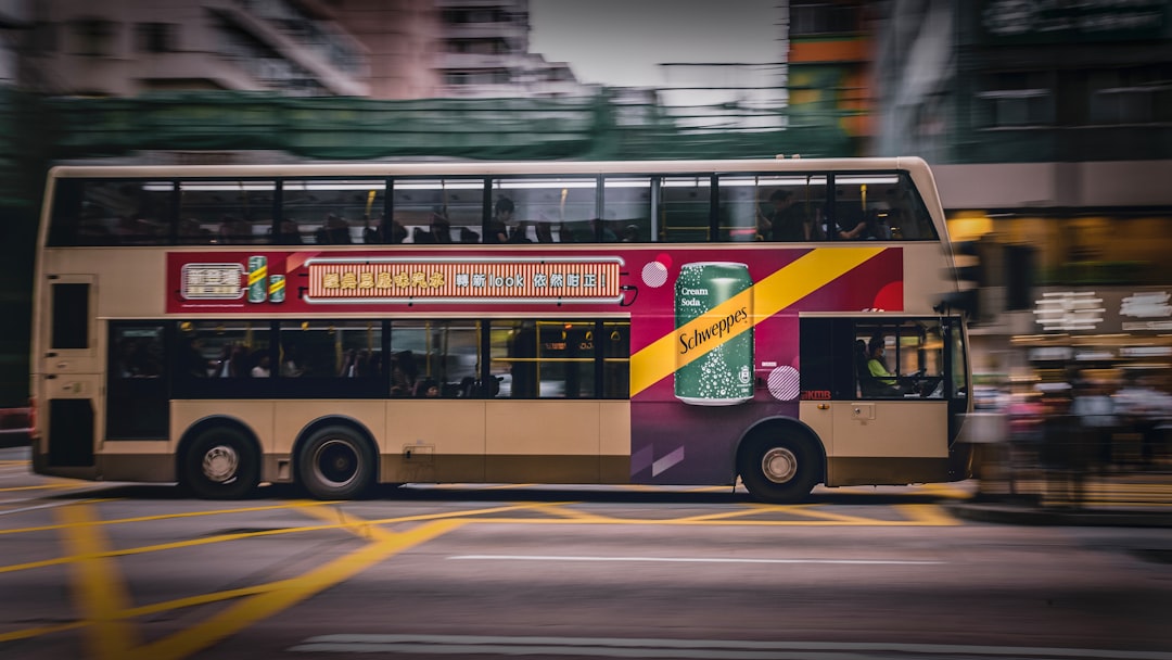 timelapse photo of brown 2-deck bus