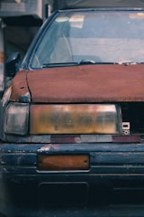 A close-up of a damaged car with visible dents and scratches.