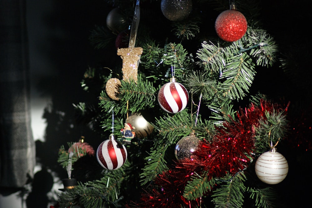 shallow focus photo of white and red Christmas baubles