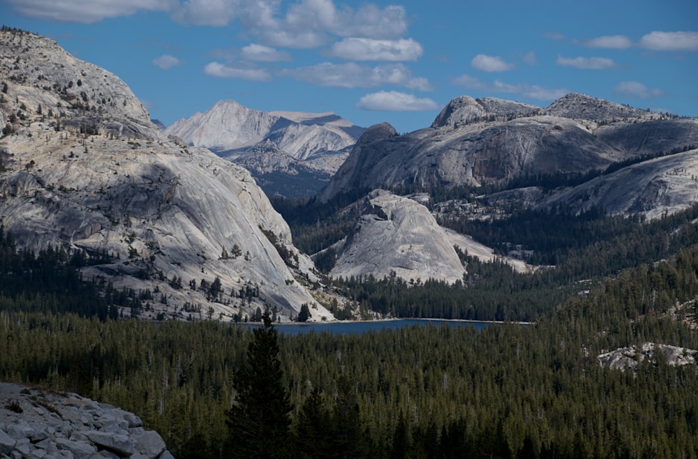 a view of a mountain range with a lake in the foreground