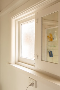 white wooden framed and clear glass window pane