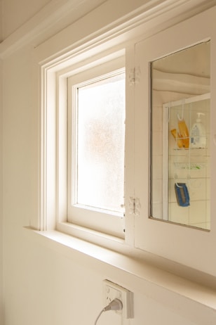 white wooden framed and clear glass window pane
