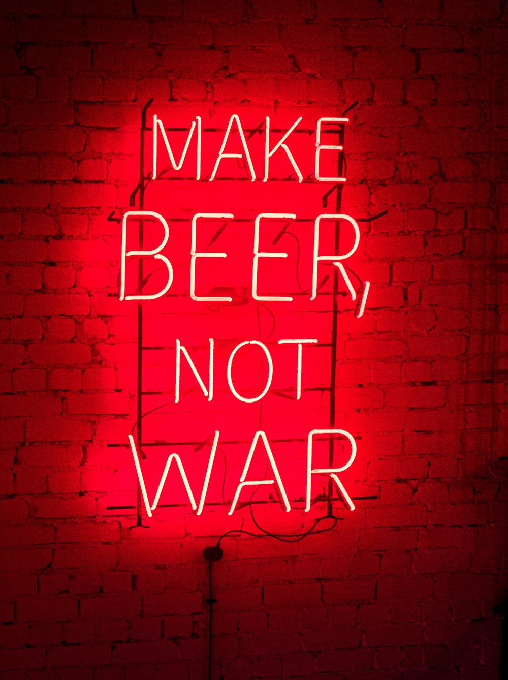 make beer not war neon light signage turned on