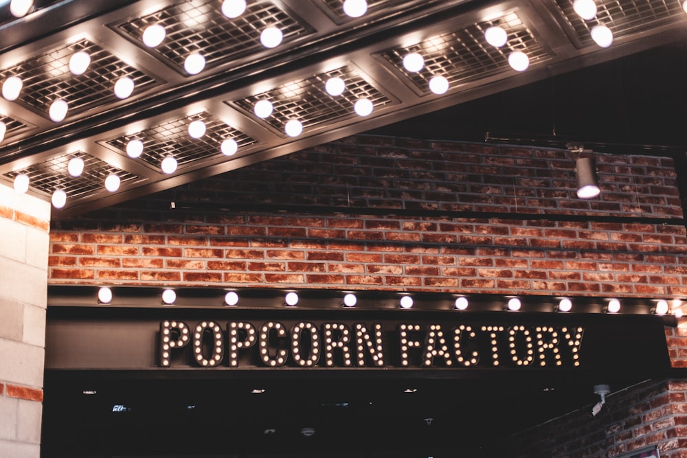 shallow focus photo of popcorn factory signage