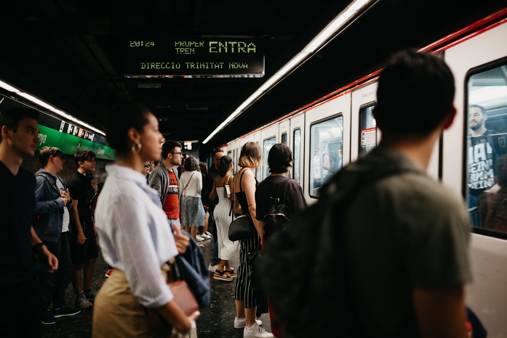 people standing on white train