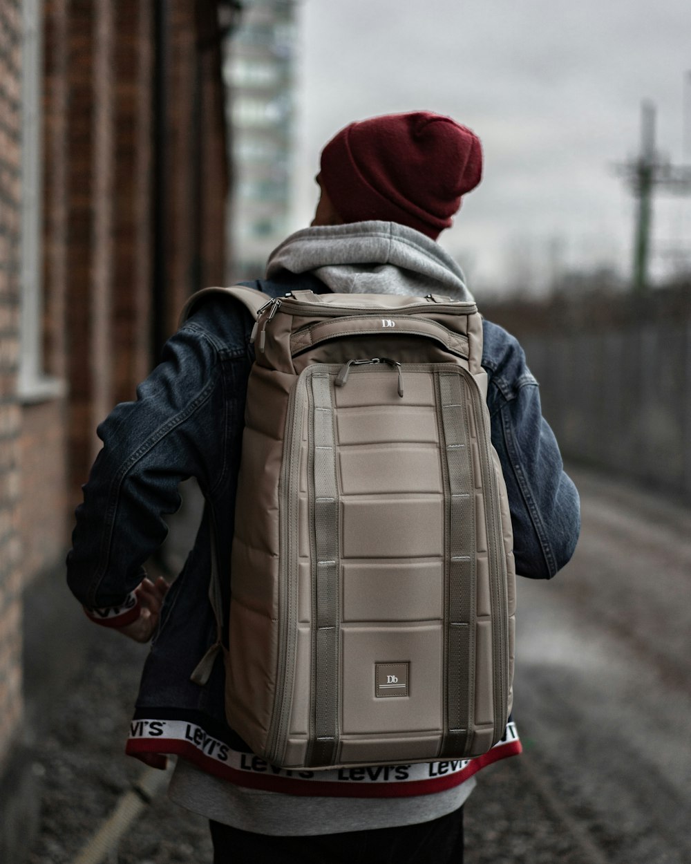 person wearing grey backpack