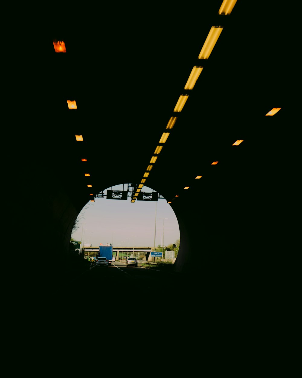 a view of a train going through a tunnel