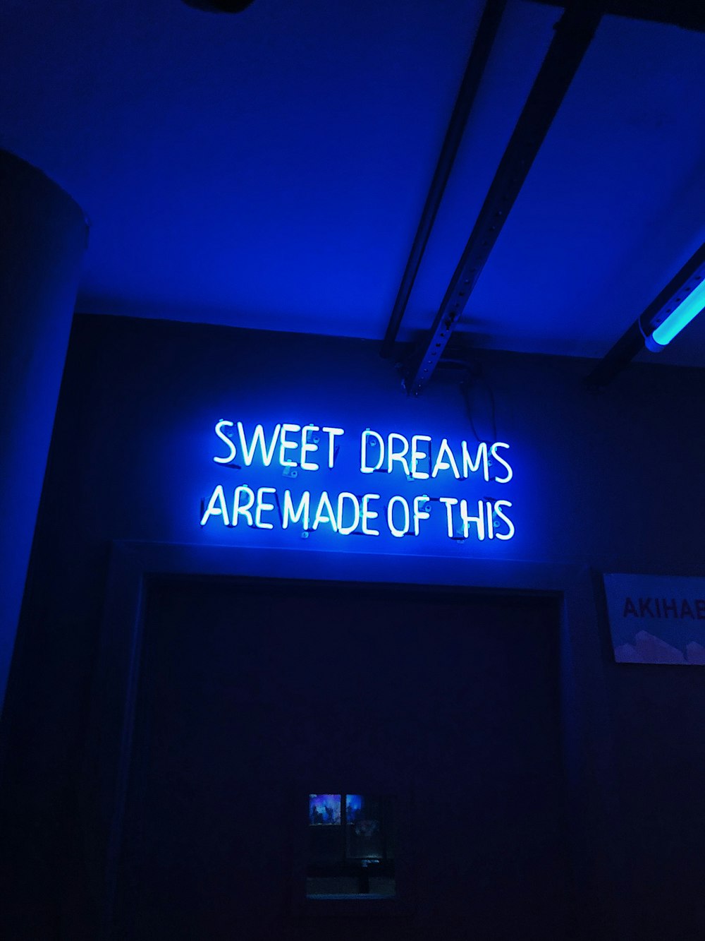 a neon sign that says sweet dreams are made of this