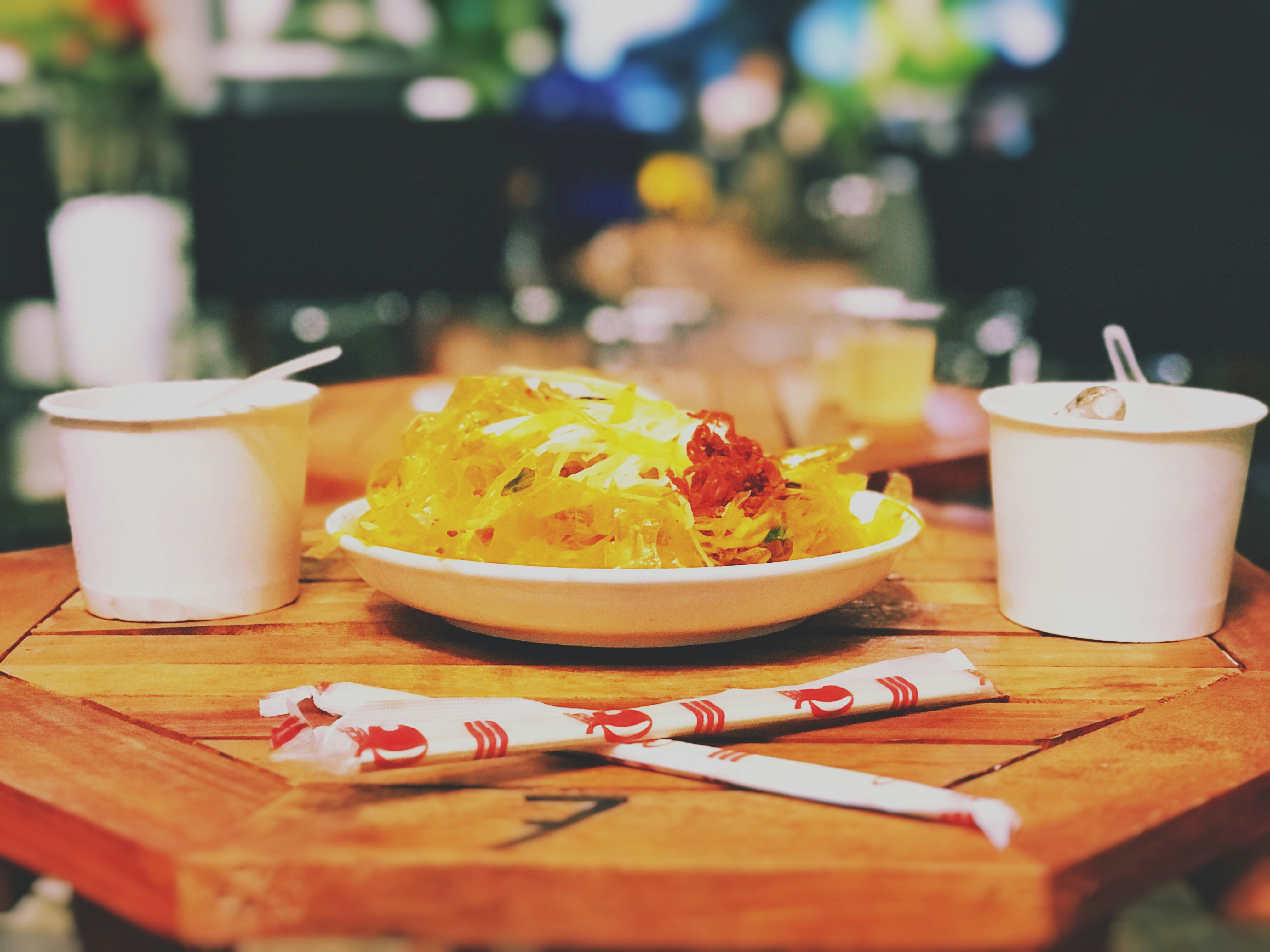 Meal set out with takeaway soup containers