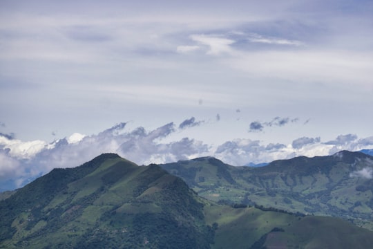 green mountains under white sky in Medellin Colombia