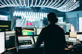 silhouette of man using audio mixer