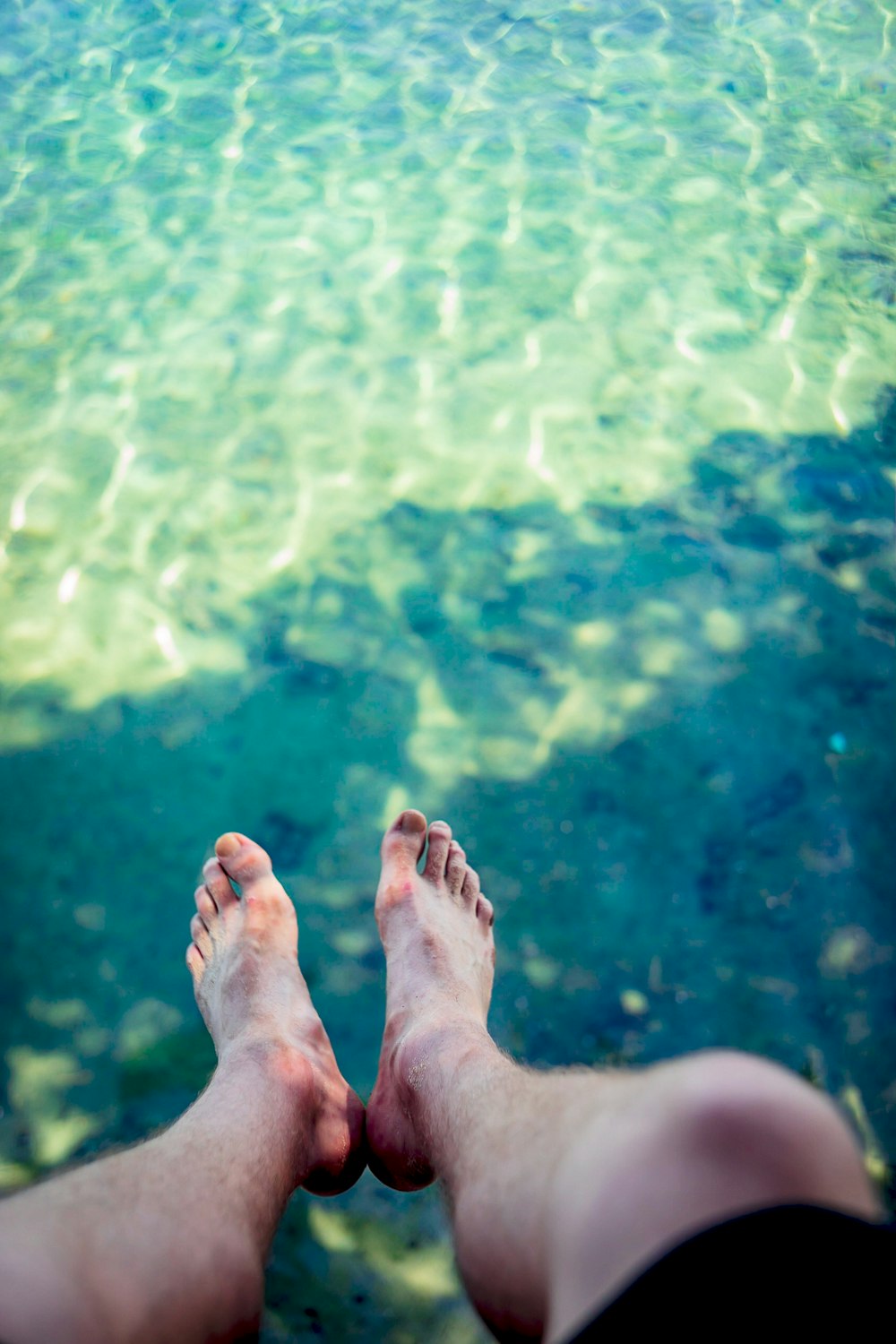 a person standing in front of a body of water