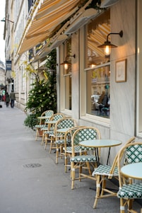 empty chairs and tables outside building