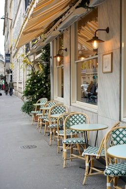 empty chairs and tables outside building