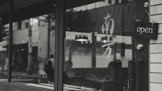 Storefront with clear opening hours displayed on the door