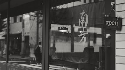 Storefront with clear opening hours displayed on the door