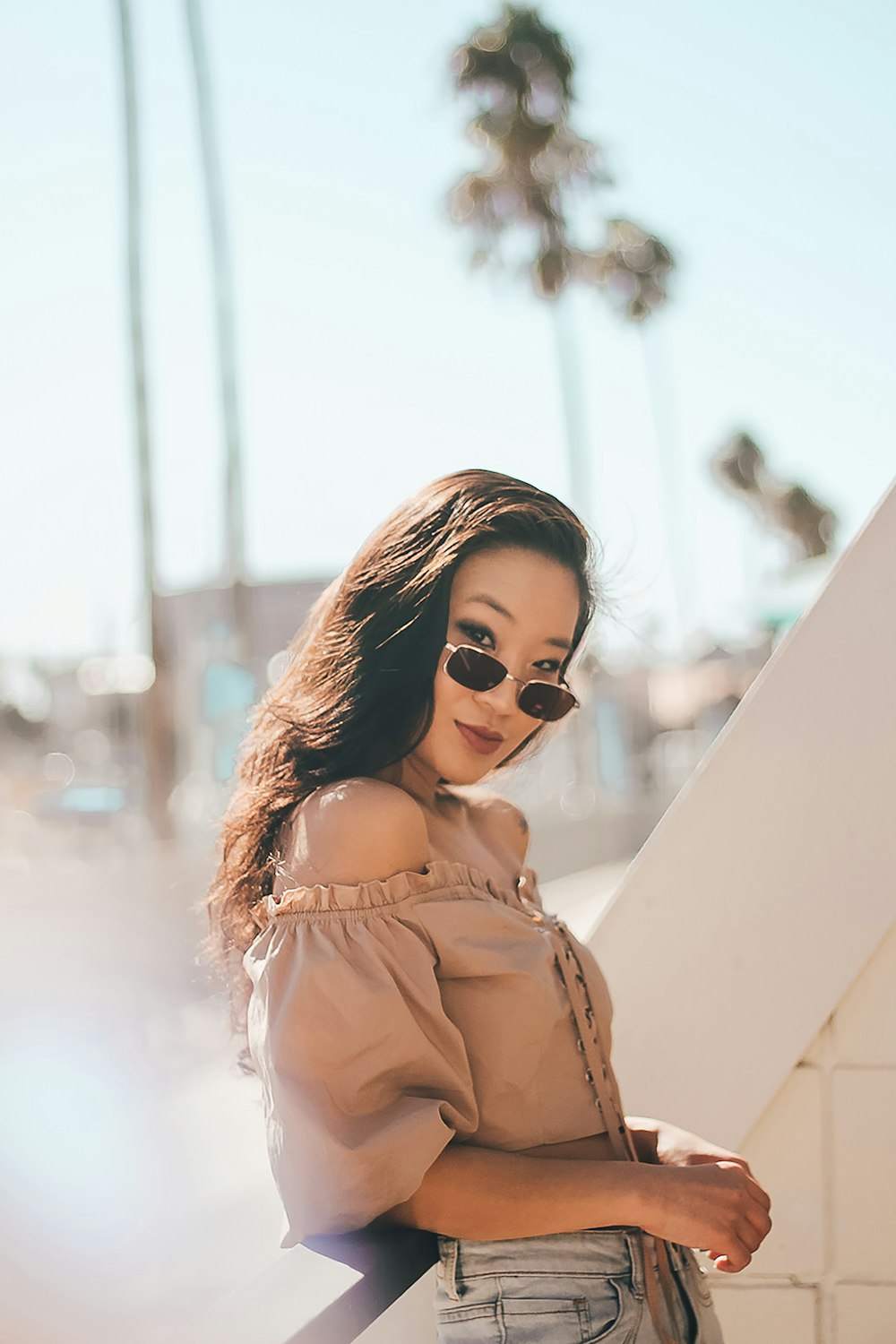 woman in brown off-shoulder top