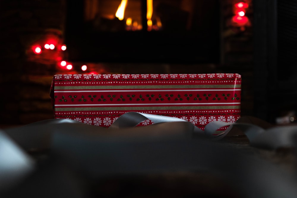 a red and white box sitting on top of a table