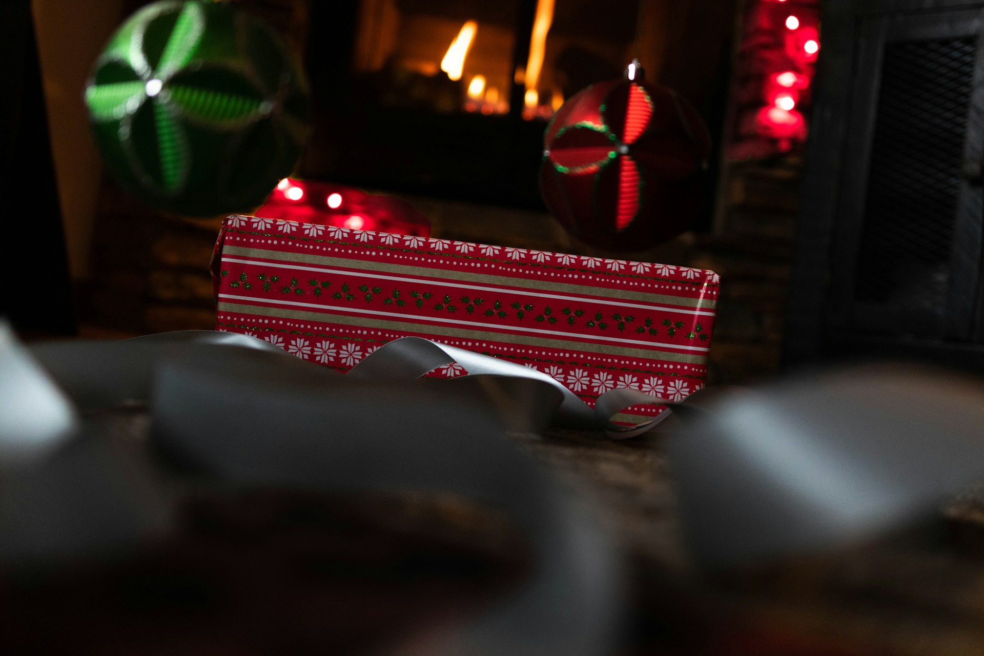 Children joyfully unwrapping a surprise box filled with delightful gifts, capturing the essence of holiday cheer.