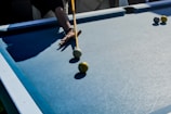 A professional player using a cue during a competitive game.