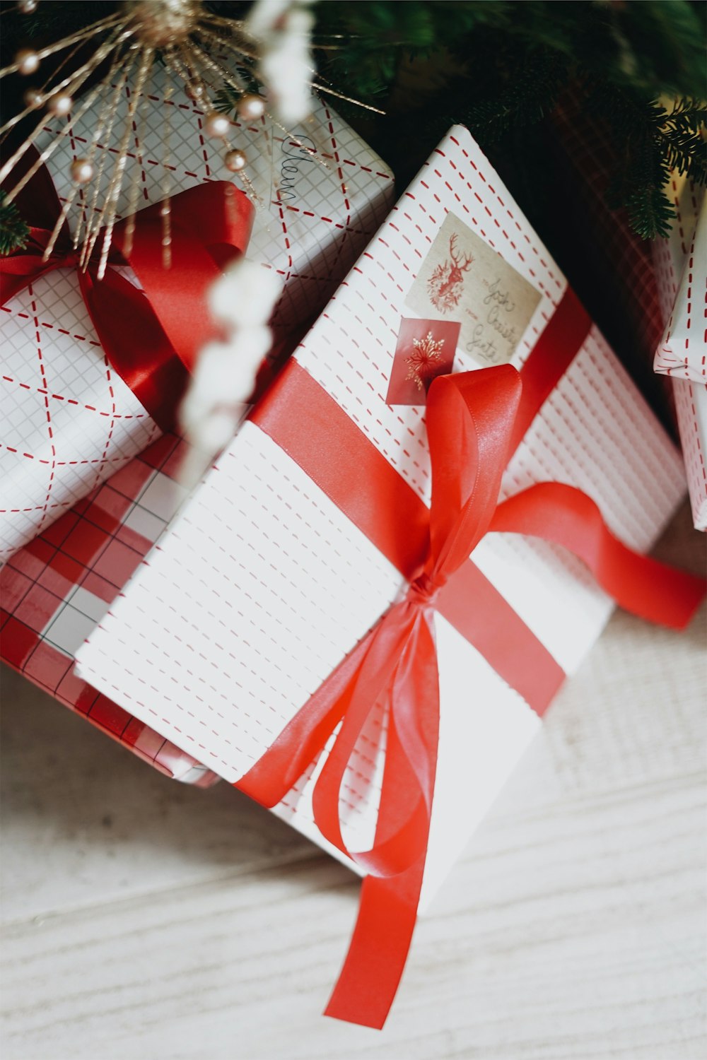 selective focus photography of white and red gift boxes