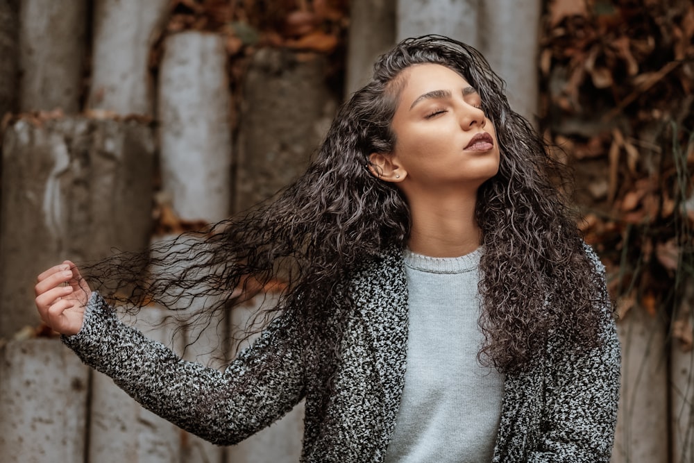 woman holding her hair