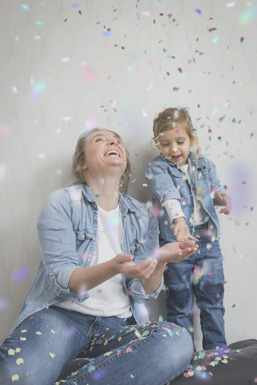 smiling woman beside girl