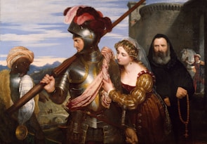 A medieval knight in armor stands prominently, holding a spear, accompanied by a woman in a luxurious dress gently holding his arm. Beside them, a monk clad in a dark habit holds a rosary. In the background, a dark-skinned man wearing a turban carries a large crossbow. The setting includes a stone fortress and mountains under a blue sky.