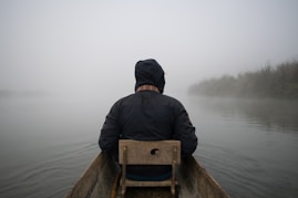 man sitting on boat