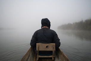 man sitting on boat