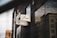 A street view of a modern building showcasing a dental office sign with the text 'Sierra Dental & Orthodontics'. The dark facade contrasts with reflective windows that mirror the surrounding urban landscape.