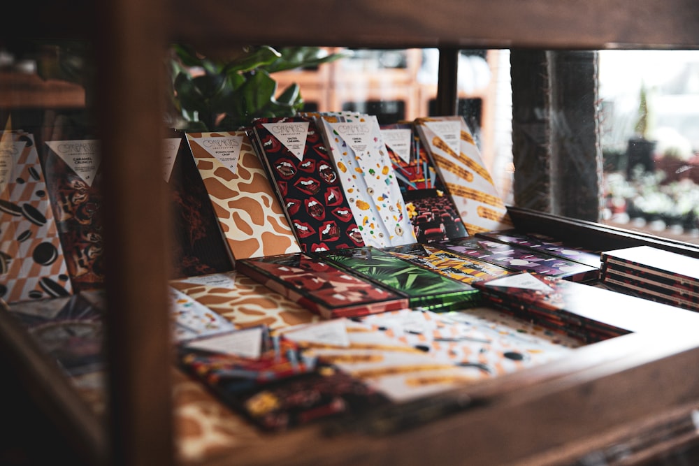 a wooden table topped with lots of cards